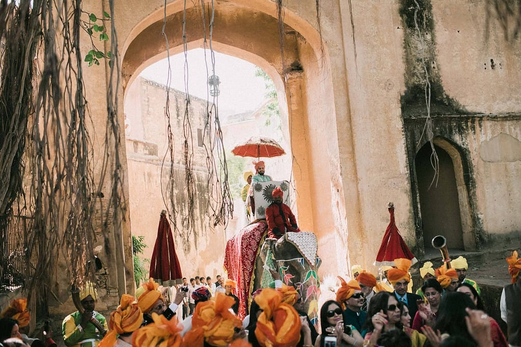 Groom grant entry on elephant