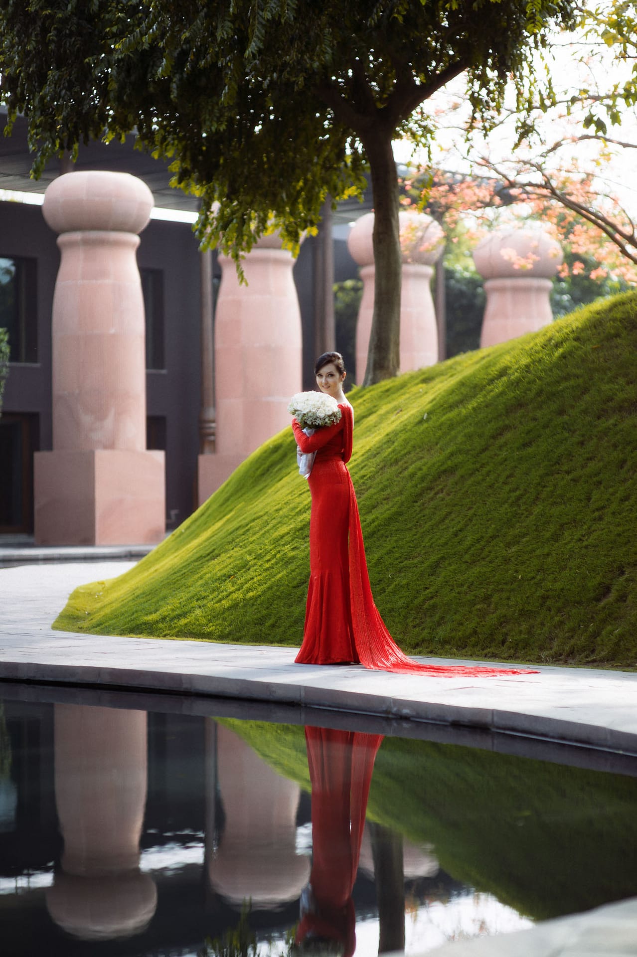 Bride walking side of pond 