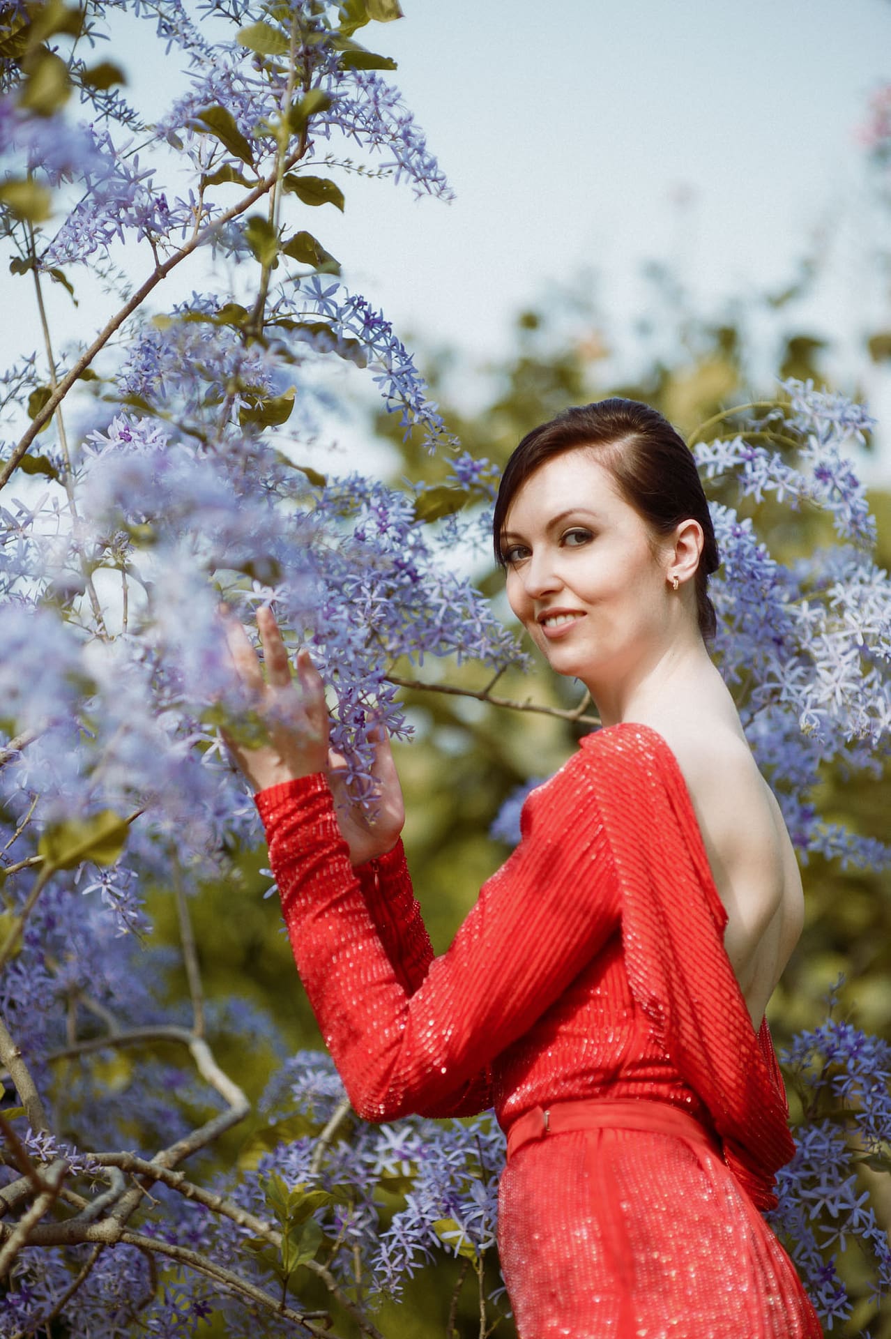 standing pose in red dress